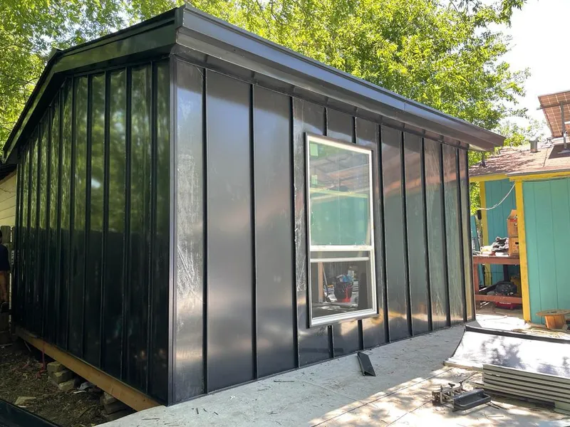 Black standing seam metal wall panels for Roof Inspection in Salem